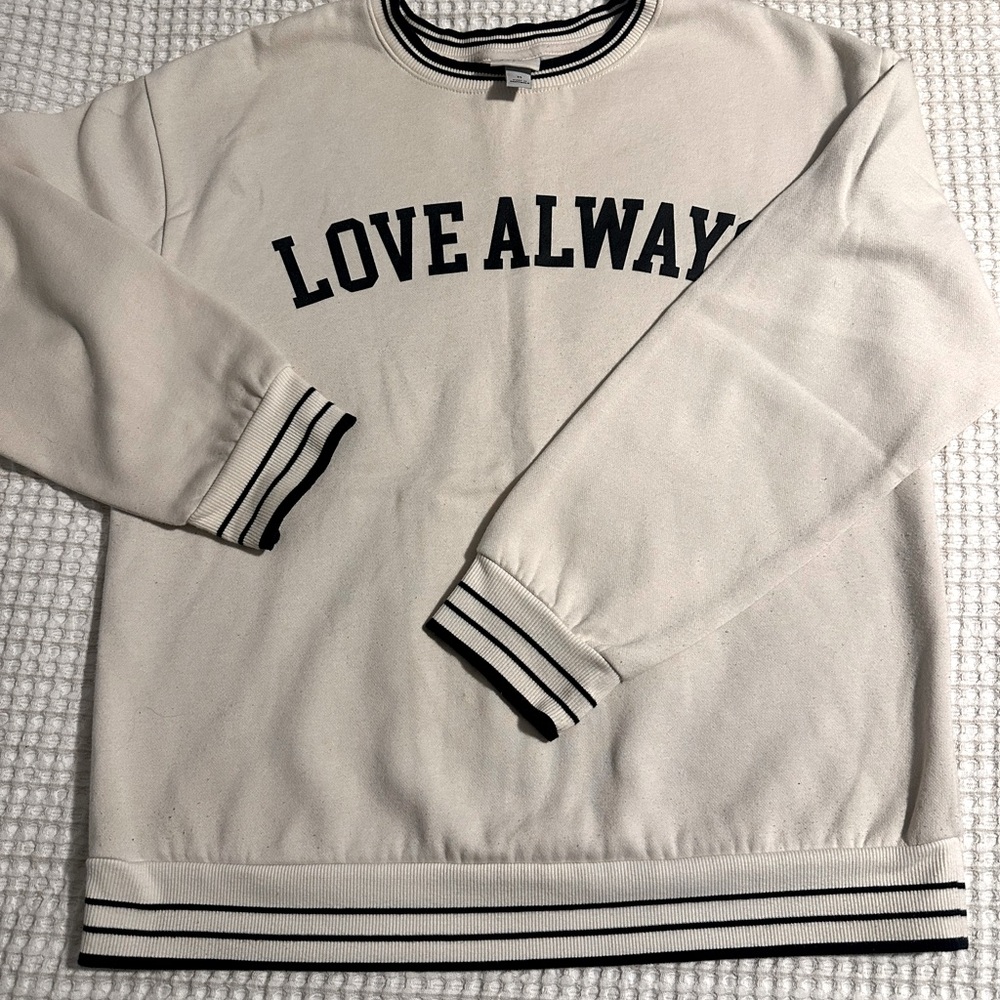 Cream and black crew neck sweatshirt. 
Size Medium